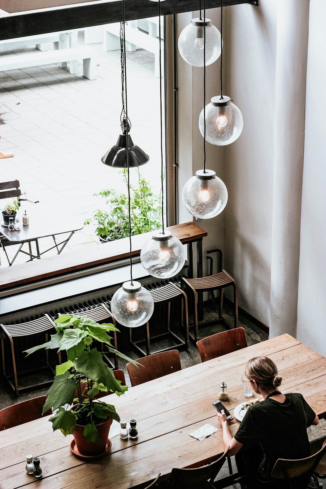 writer observing people in cafe