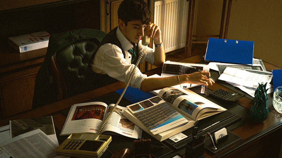 young writer at desk typing mystery novel