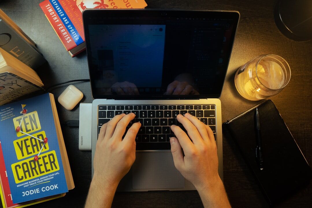 young writer at desk typing mystery novel